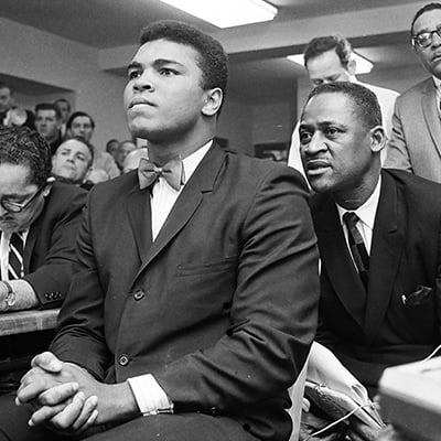 Muhammad Ali in a hearing with the Illinois Athletic Commission on February 25, 1966 over whether to cancel his fight against Ernie Terrell for Ali’s refusal to serve in the military. Photo: ST-50000294-0001, Chicago Sun-Times collection, Chicago History Museum