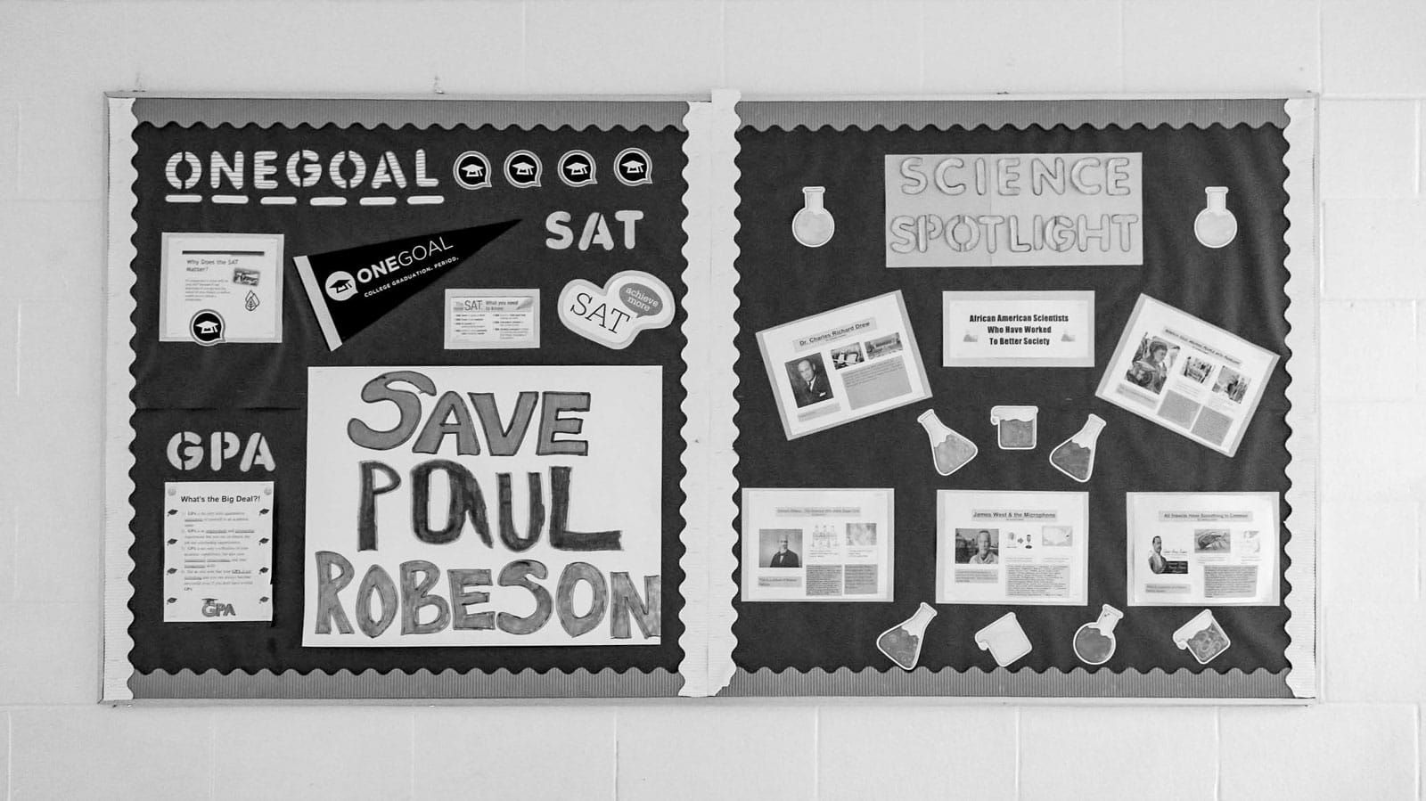 Pinboard with sign that reads 'Save Paul Robeson'