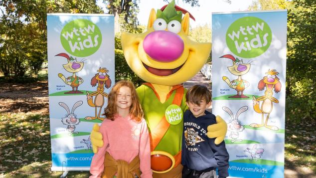 Nature Cat posing with two children