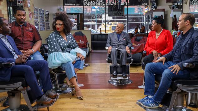 Group seated in barbershop having a conversation
