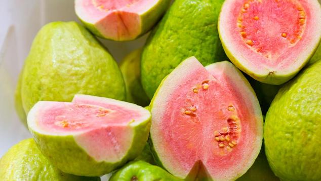 Guava showing green skin and pink flesh