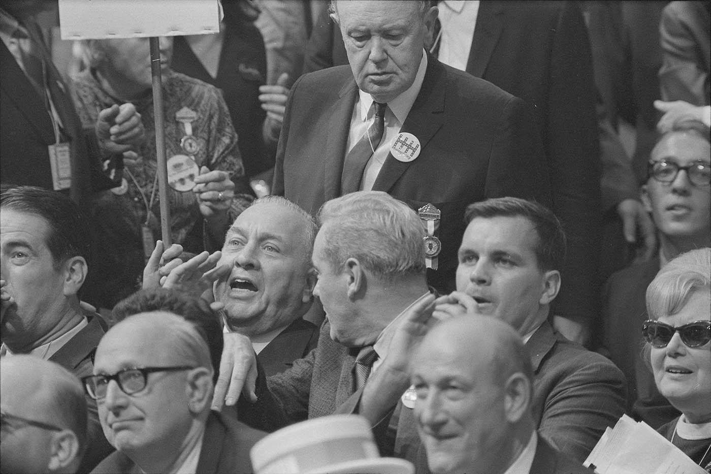 Mayor Richard J. Daley reacts to Senator Abraham Ribicoff's denunciation of Chicago Police Tactics at the 1968 Democratic National Convention. Daley's son, Richard M. Daley, sits to the right. Photo: Warren K. Leffler