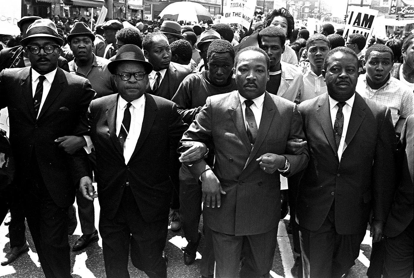 The Rev. Ralph Abernathy, right, and Bishop Julian Smith, left, flank Dr. Martin Luther King, Jr., during a civil rights march in Memphis, Tenn., March 28, 1968. AP Photo/Jack Thornell