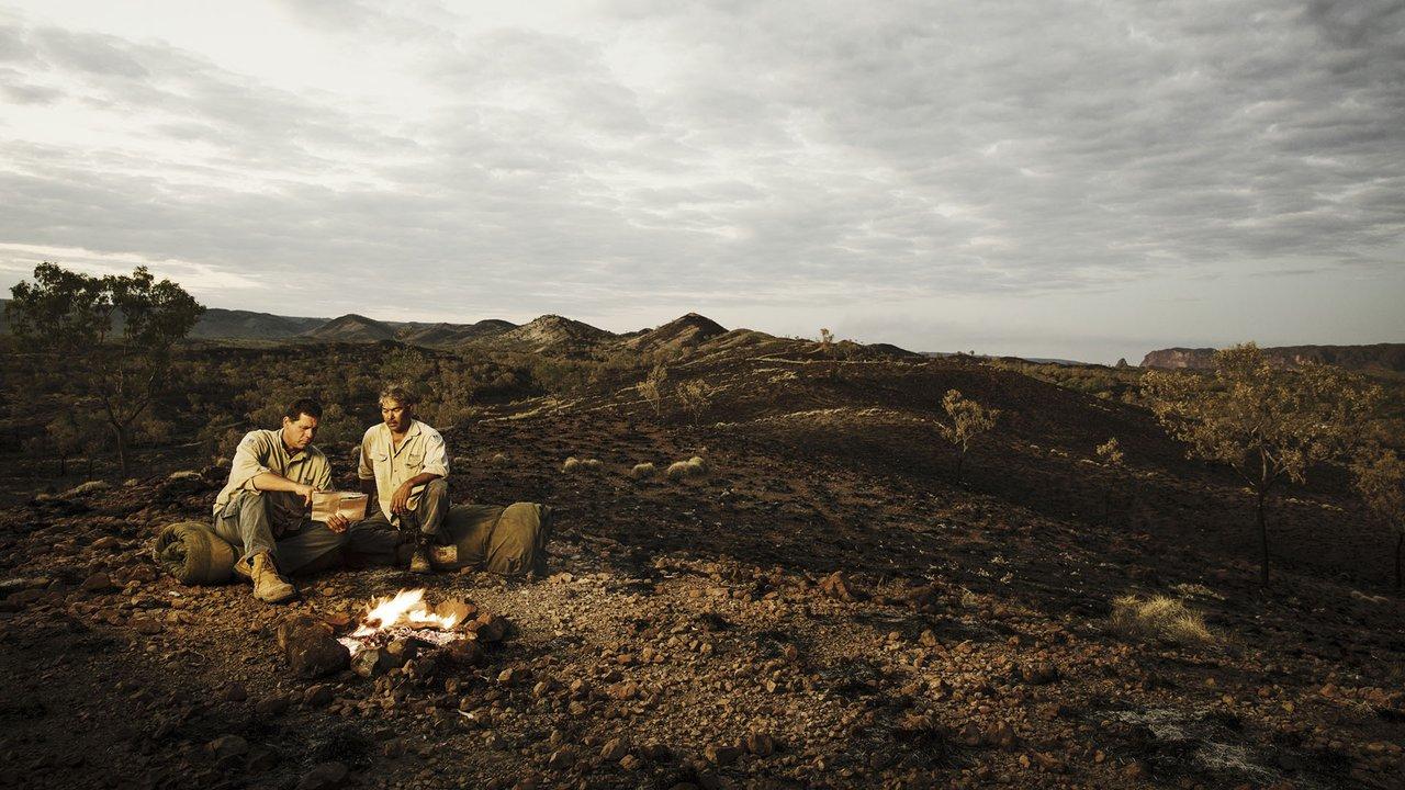 Indigenous rangers, Vincent and Cyril, by firelight. Photo: Jeremy Simons