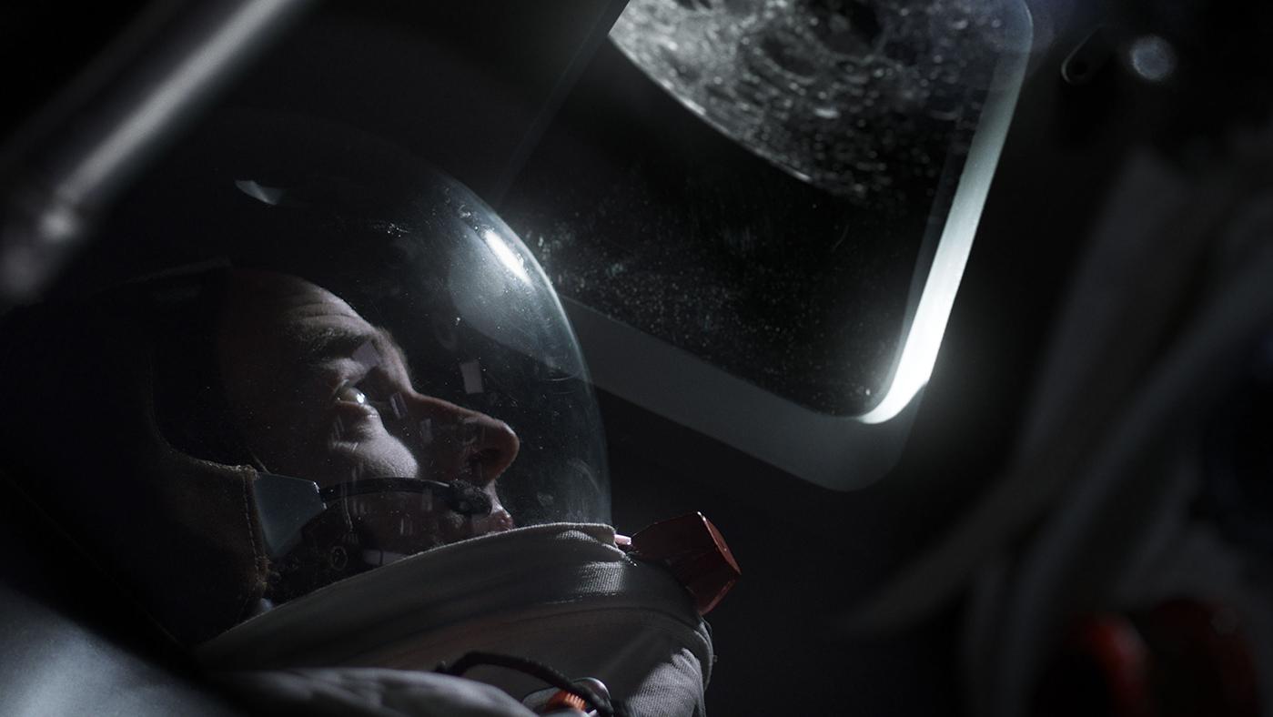Michael Collins (Patrick Kennedy) looking at the Moon out of the Command Service Module window. Photo: Courtesy BBC Studios; Photographer - Gary Moyes
