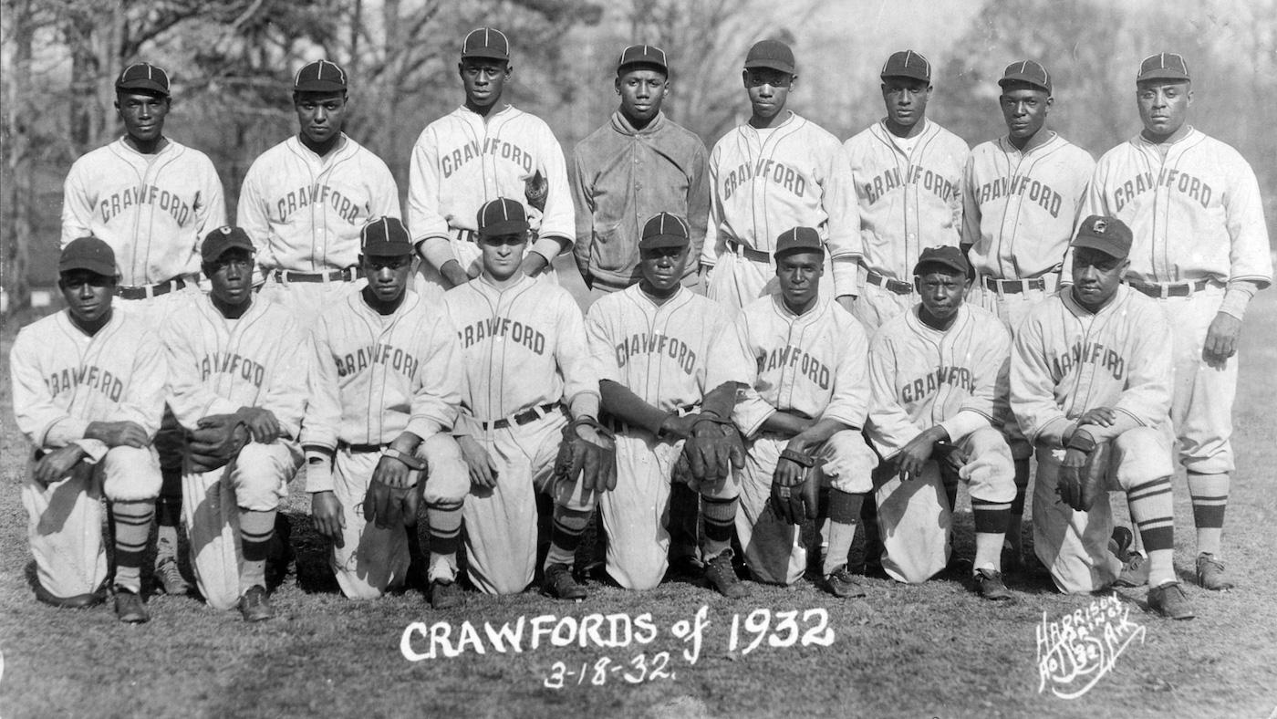 The 1932 Pittsburgh Crawfords, including Satchel Paige (top row, third from left) and Josh Gibson (to the right of Paige). Photo: Harrison Studio/Wikimedia Commons