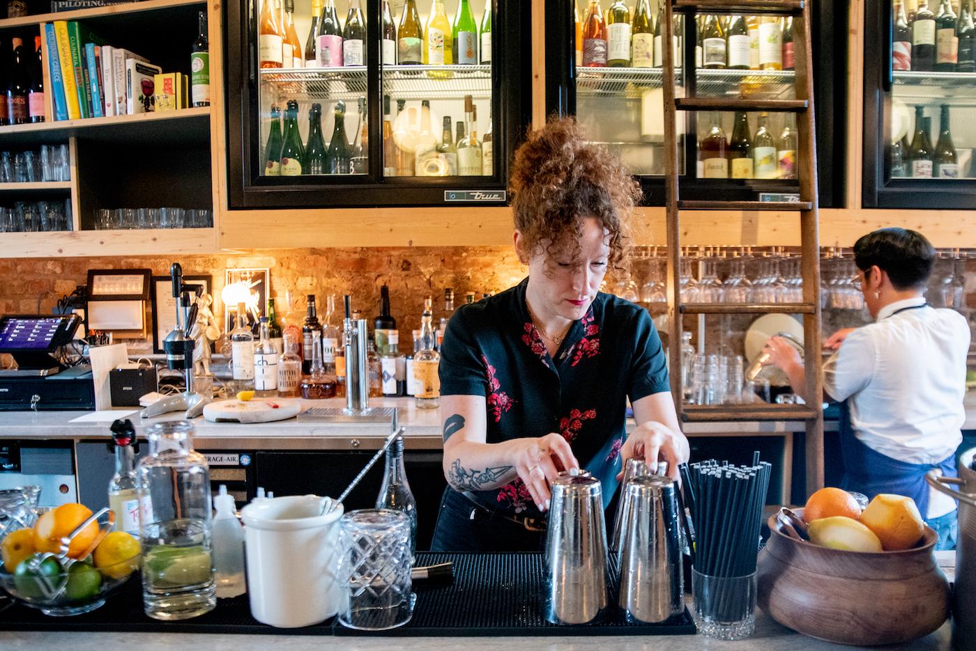 General manager Jessica Line, 36, steps behind the bar during the dinner service at Wherewithall at 3472 N. Elston Ave. in Chicago, Illinois. Photo: WTTW/Kathleen Hinkel