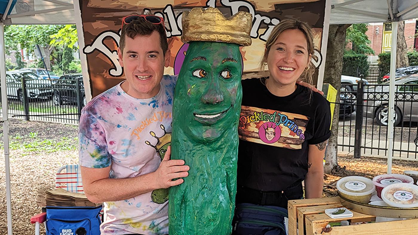 Alex Skrzypczyk and Brian Greene with their pickle sculpture 