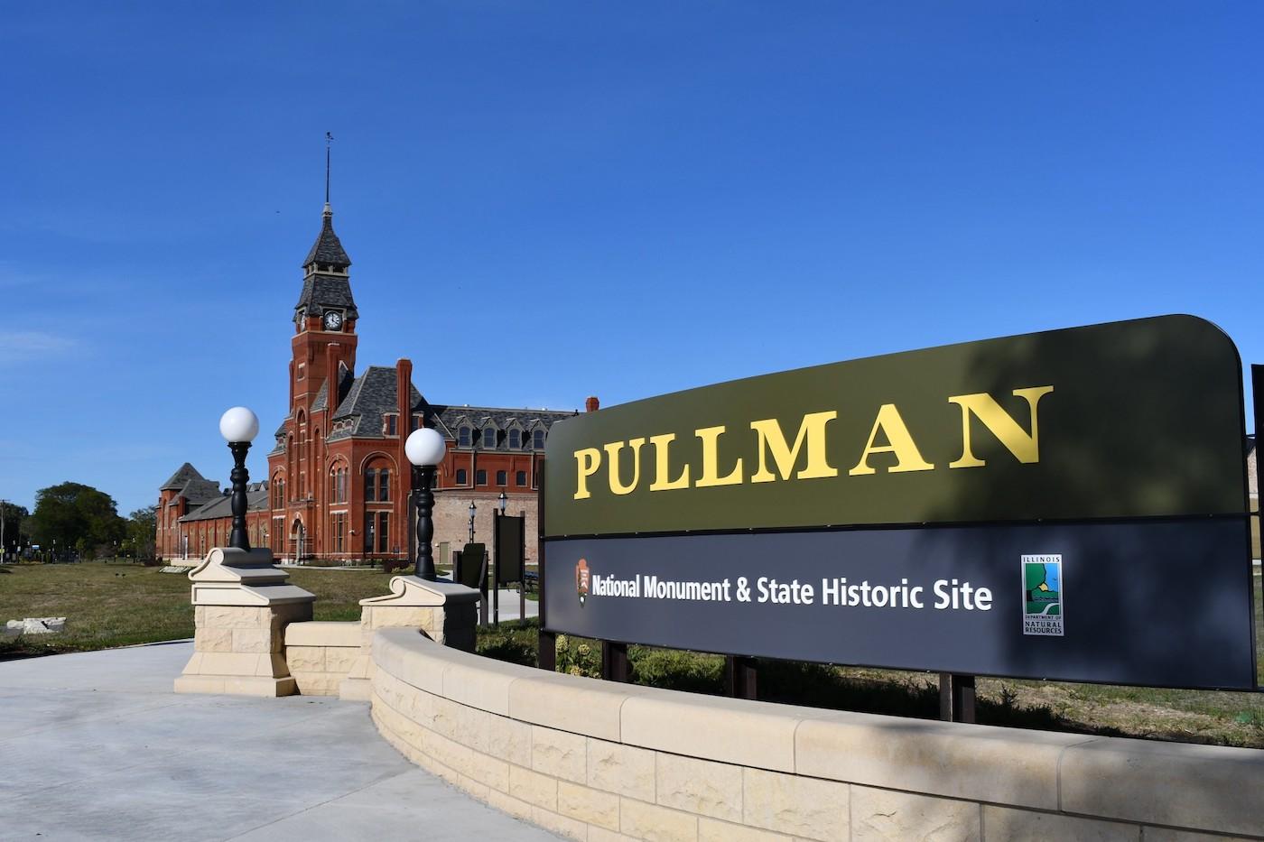 The Pullman National Park sign and clock tower behind it 