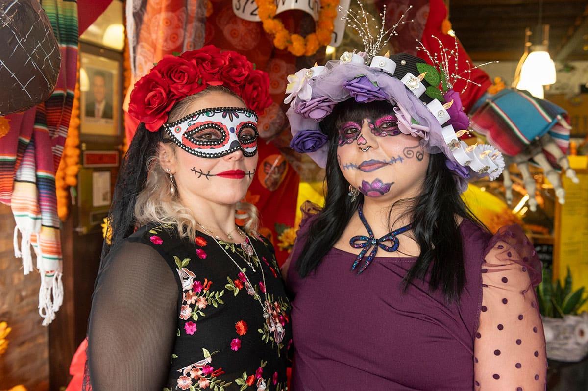 Sisters and co-owners of Pan Artesanal Lizette and Marisol Espinoza dressed as La Catrina