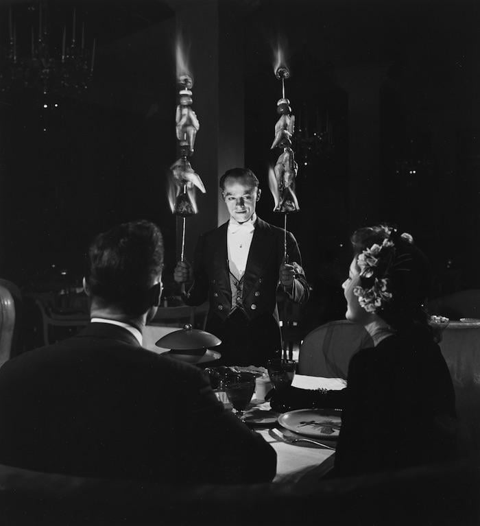 A waiter serving a Flaming Sword dinner at Chicago's Pump Room in 1943. Photo: HB-07662, Chicago History Museum, Hedrich-Blessing Collection