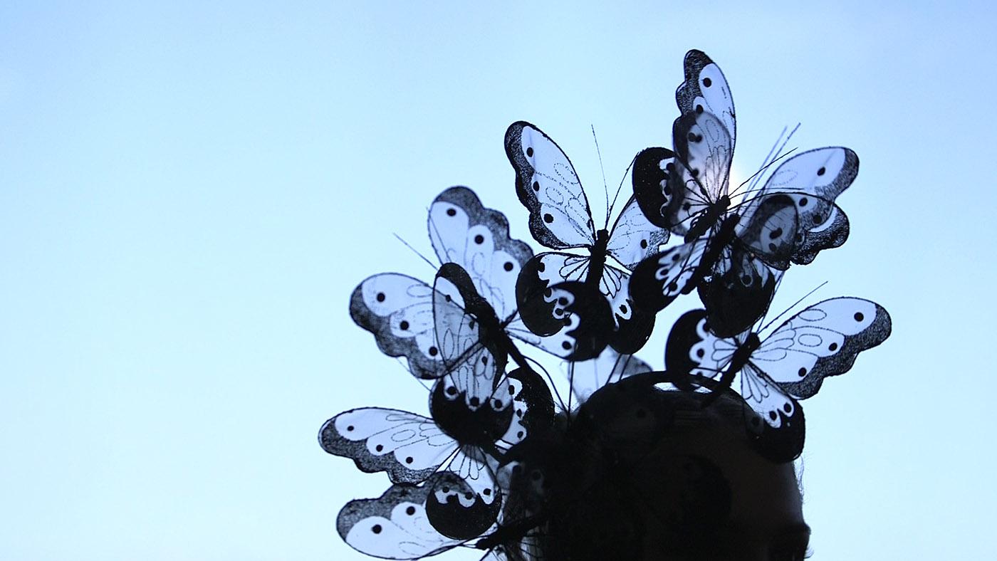 A butterfly hat by Arturo Rios on Articulate with Jim Cotter