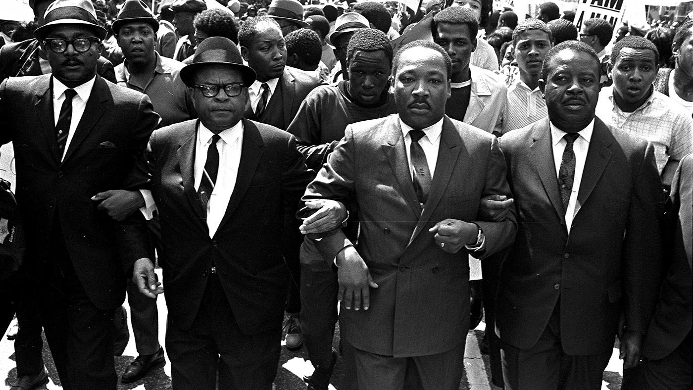 The Rev. Ralph Abernathy, right, and Bishop Julian Smith, left, flank Dr. Martin Luther King, Jr., during a civil rights march in Memphis, Tenn., March 28, 1968. AP Photo/Jack Thornell