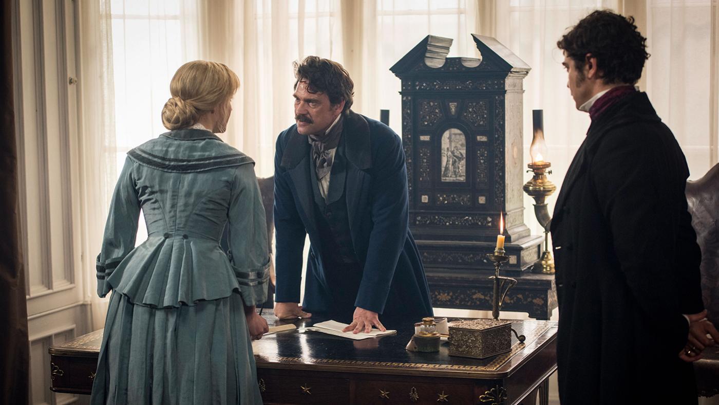 Olivia Vinall as Laura Fairlie, Dougray Scott as Sir Percival Glyde, and Riccardo Scamarcio as Count Fosco in The Woman in White. Photo: The Woman in White Productions Ltd. / Steffan Hill / Origin Pictures