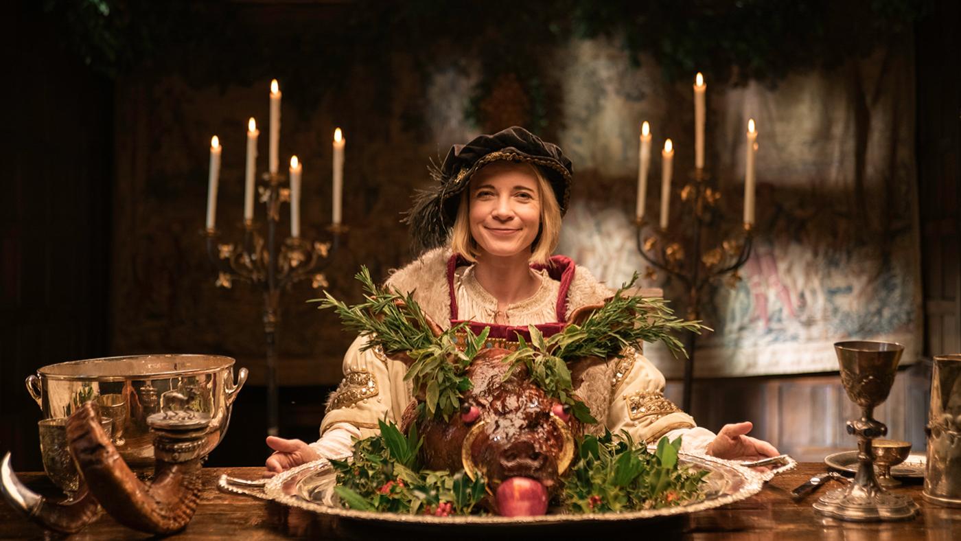 Lucy Worsley in Henry VIII costume with boar's head for Lucy Worsley's 12 Days of Tudor Christmas. Photo: Burning Bright Productions