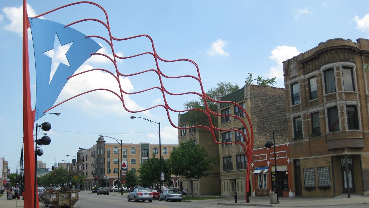 The steel Puerto Rican flag over Division Street in Humboldt Park. Photo: Richie Diesterheft/Wikimedia Commons 