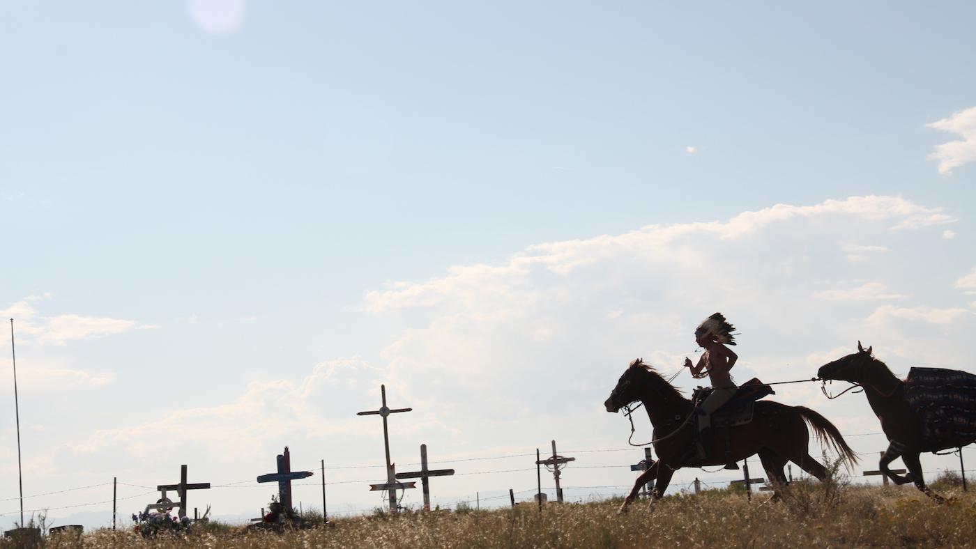 The Last Ride: Angelo Sage, Northern Arapaho, at Sharp Nose Cemetery, Wind River Reservation, WY, 2018. Photo: Sophie Barksdale