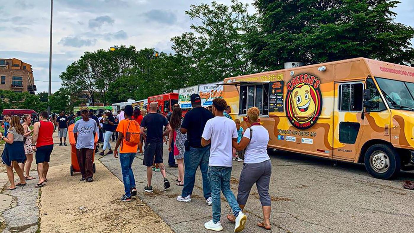 People walking through the Chicago Food Truck Festival