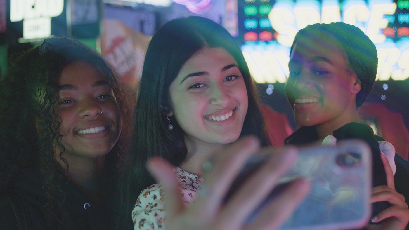 TikTok Influencer Feroza Aziz taking selfie with her friends in an arcade. Image: Shane Sigler