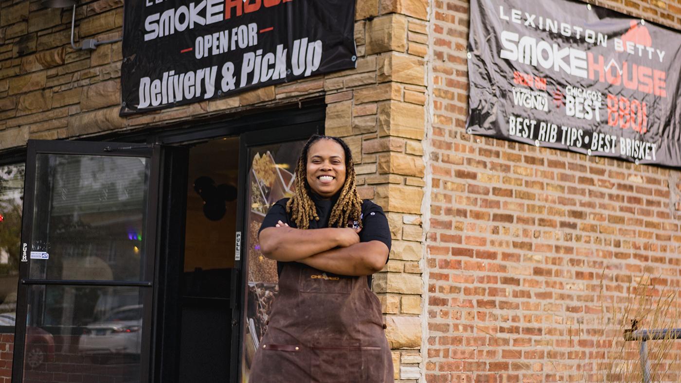 Pitmaster Dominque Leach in front of Lexington Betty Smoke House 