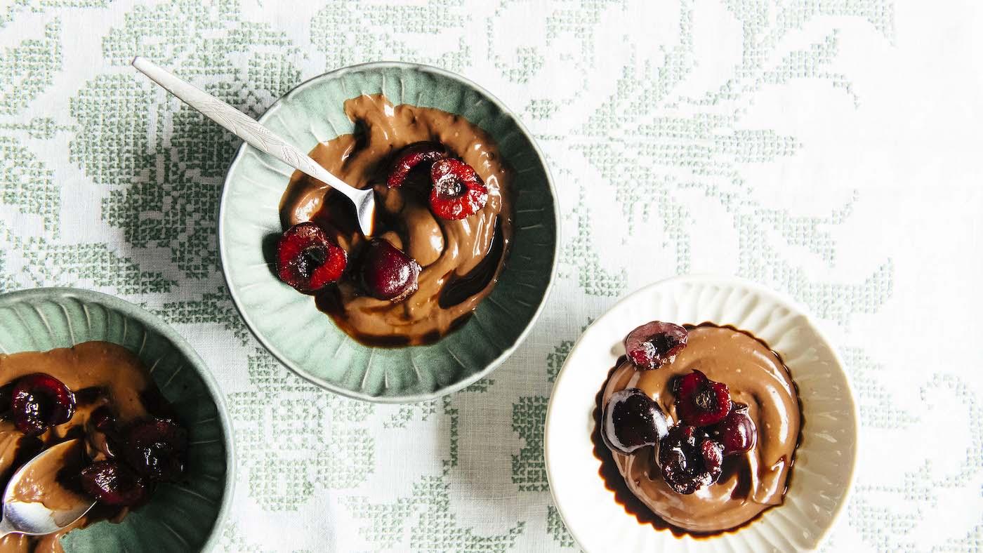 Chocolate pudding with coffee-soaked black cherries