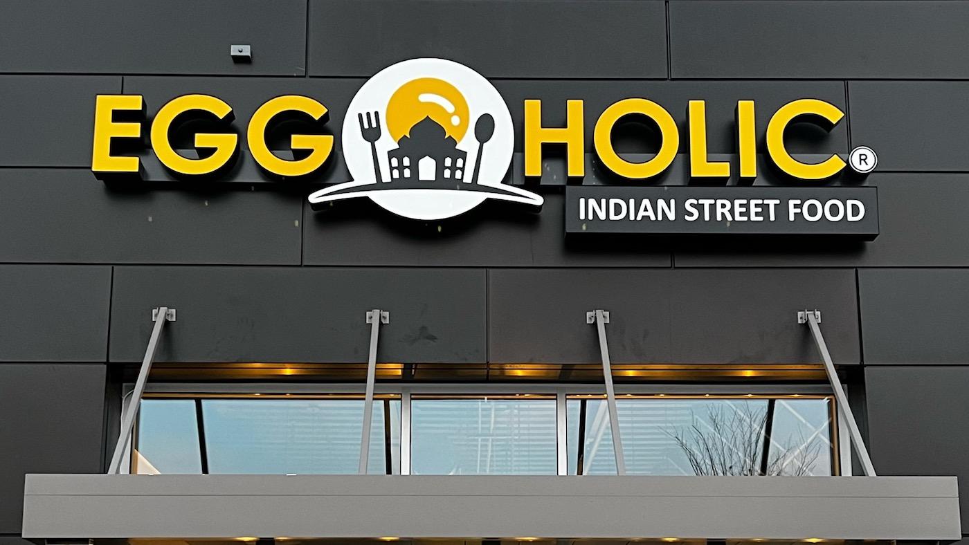 A sign on a building in Nashville for Eggholic, an Indian Street Food mini chain restaurant