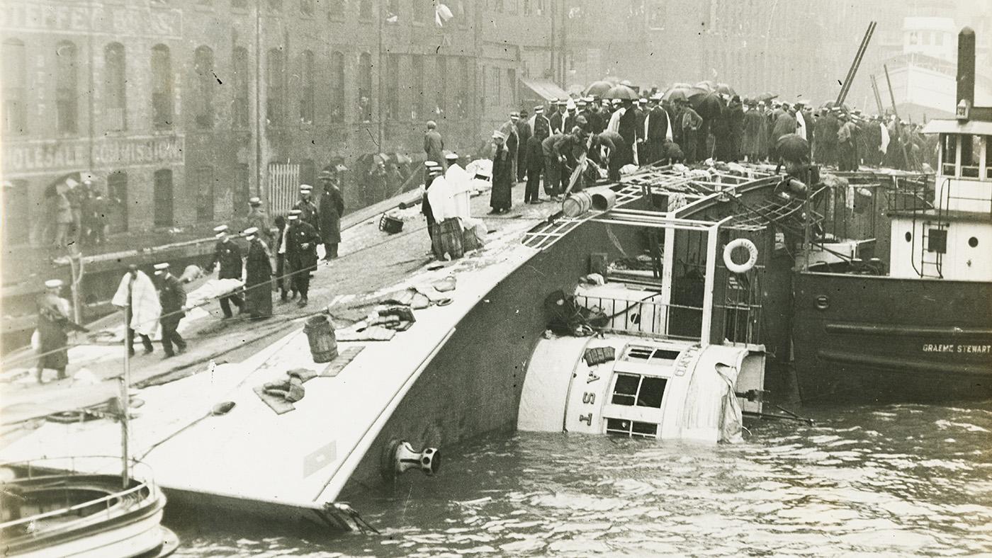A black and white image of the SS Eastland capsized in the Chicago River