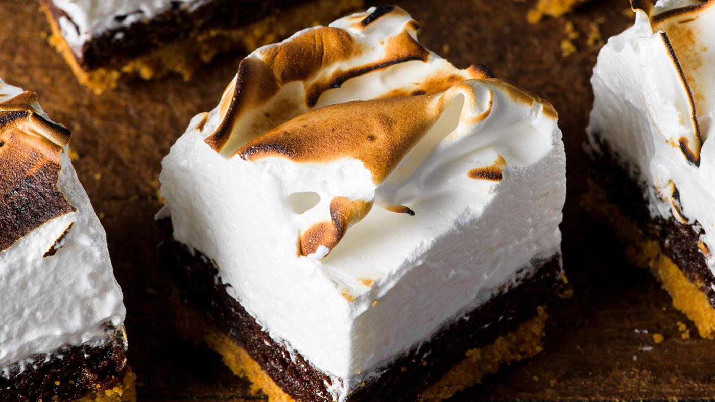 S'mores bars with toasted meringue on top of a brownie and crust
