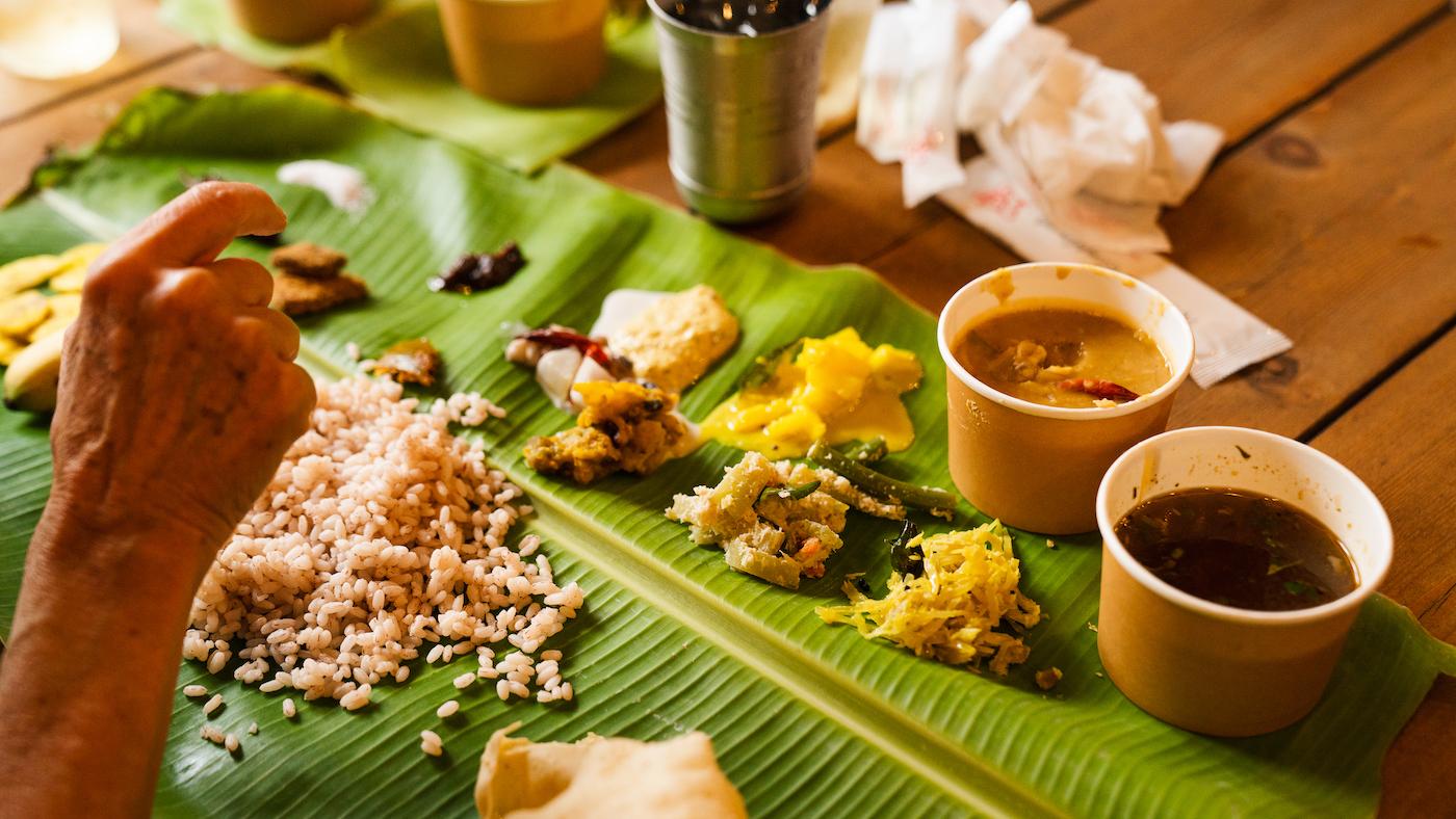 Various Keralite dishes served on a banana leaf for an Onam sadya