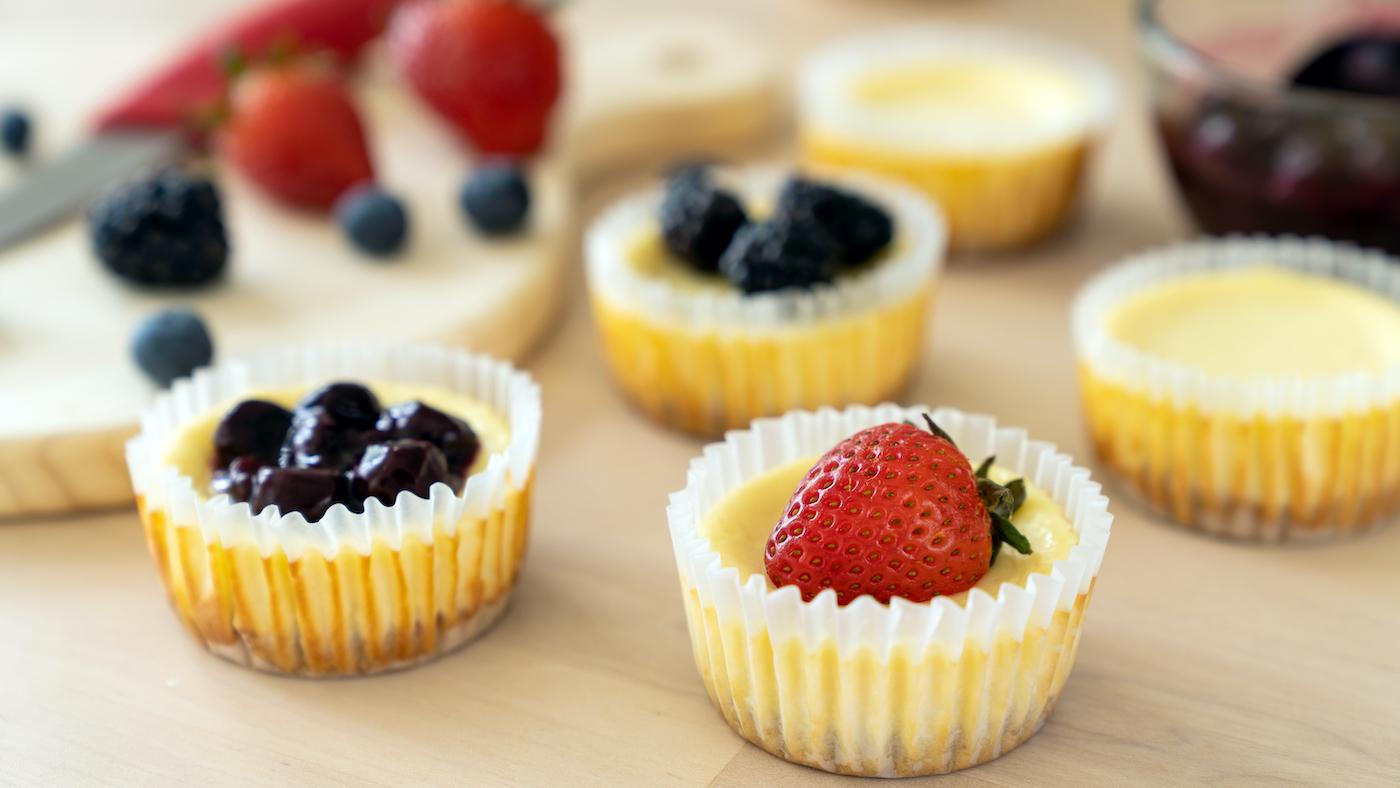 Cupcakes with fruit on top of them