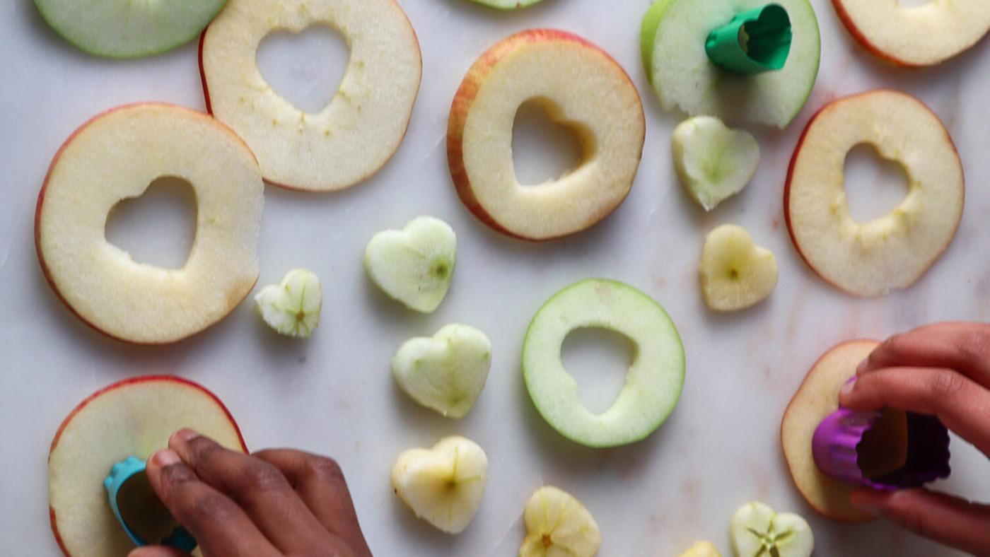 Apple slices with the center cut out in a heart shape