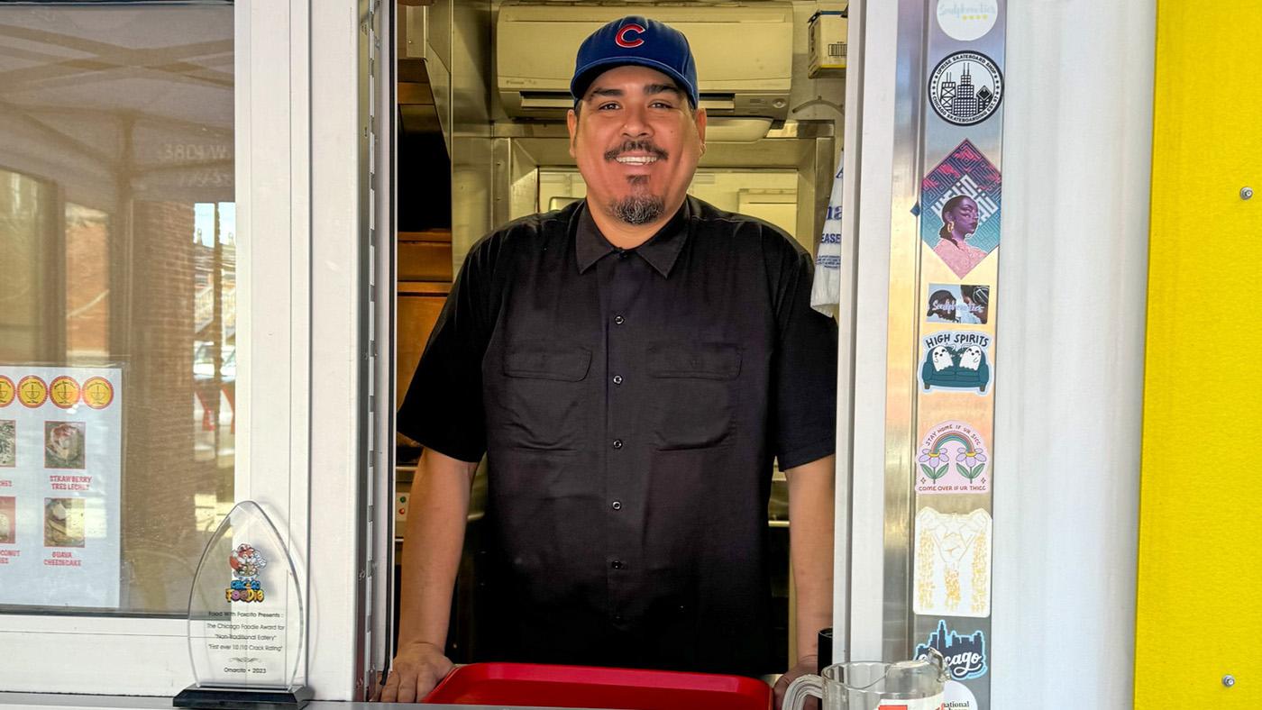 Omar Cadena standing at the ordering window at Omarcito's