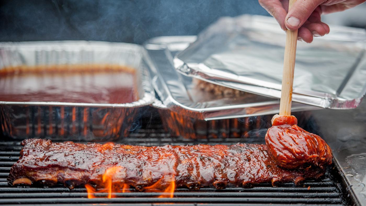 A slab of ribs on a grill