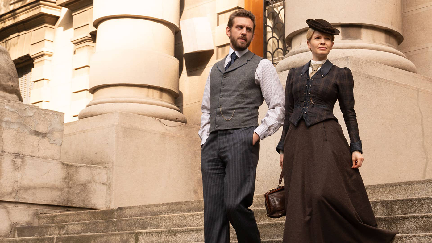 Alexander Blake and Miss Scarlet on the stairs outside a building