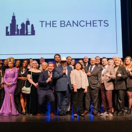 The winners of the Jean Banchet Awards pose onstage under a screen that says The Banchets